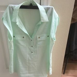 Green sleeveless blouse